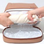 کیف آرایشی نیم دایره چرم قهوه ای بخش زیرین
