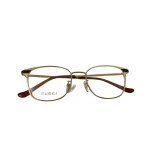 عینک طبی گوچی مدل Gucci GG0578OK کد 001 با فریم طلایی و دسته مشکی